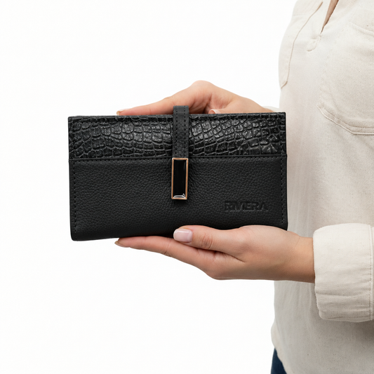 Model holding the black Elena Textured Large Wallet
